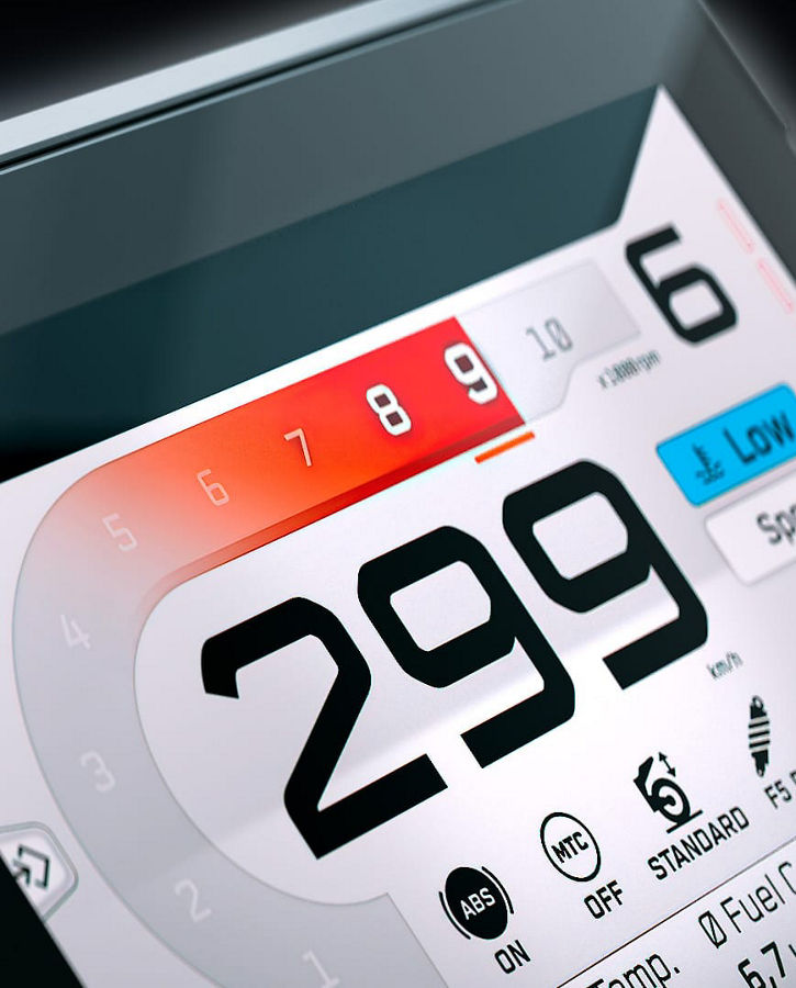 Close-up of an AUMOVIO TFT display for motorcycles. Aumovio offers a range of high-performance instrument displays tailored for motorcycles, designed to offer maximum flexibility. It employs automotive-grade technology with optical bonding for crystal-clear visuals. 