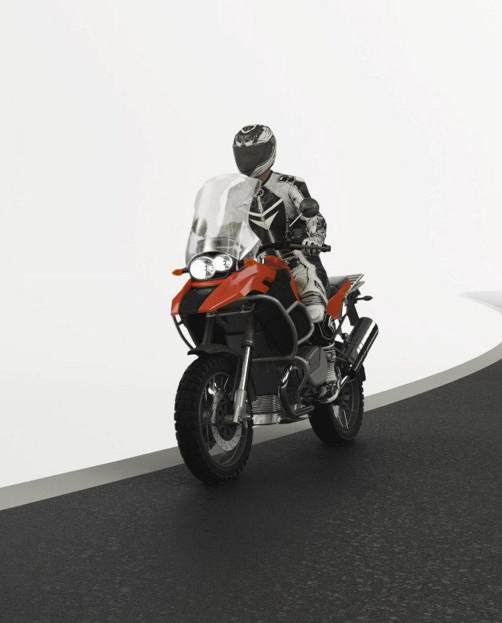 3D-generated image of a motorcyclist on a road.  n the world of motorcycling, safety comes first. We are dedicated to developing solutions that improve the driving experience while keeping you safe on the road.