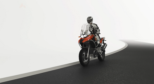3D-generated image of a motorcyclist on a road.  n the world of motorcycling, safety comes first. We are dedicated to developing solutions that improve the driving experience while keeping you safe on the road.