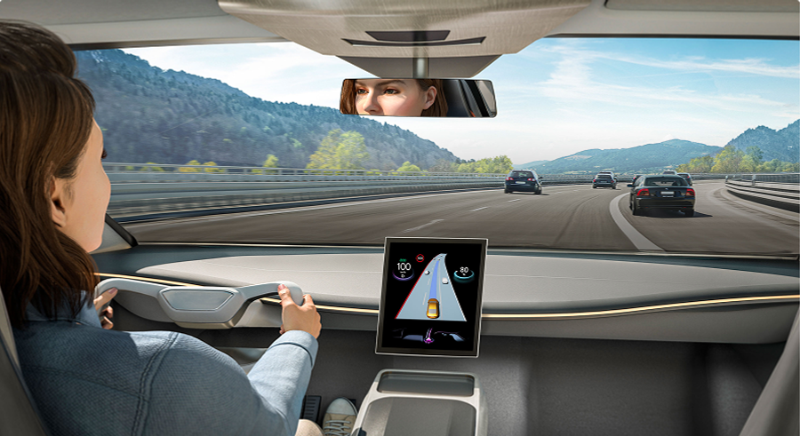 Bild der virtuellen 3D-Umgebungsansicht, die andere Verkehrsteilnehmer, Straßen mit Fahrbahnmarkierungen und Gebäude rund um die aktuelle Position in 3D-Modellen zeigt. 