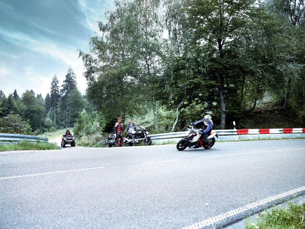 Two wheelers braking in a curve scene