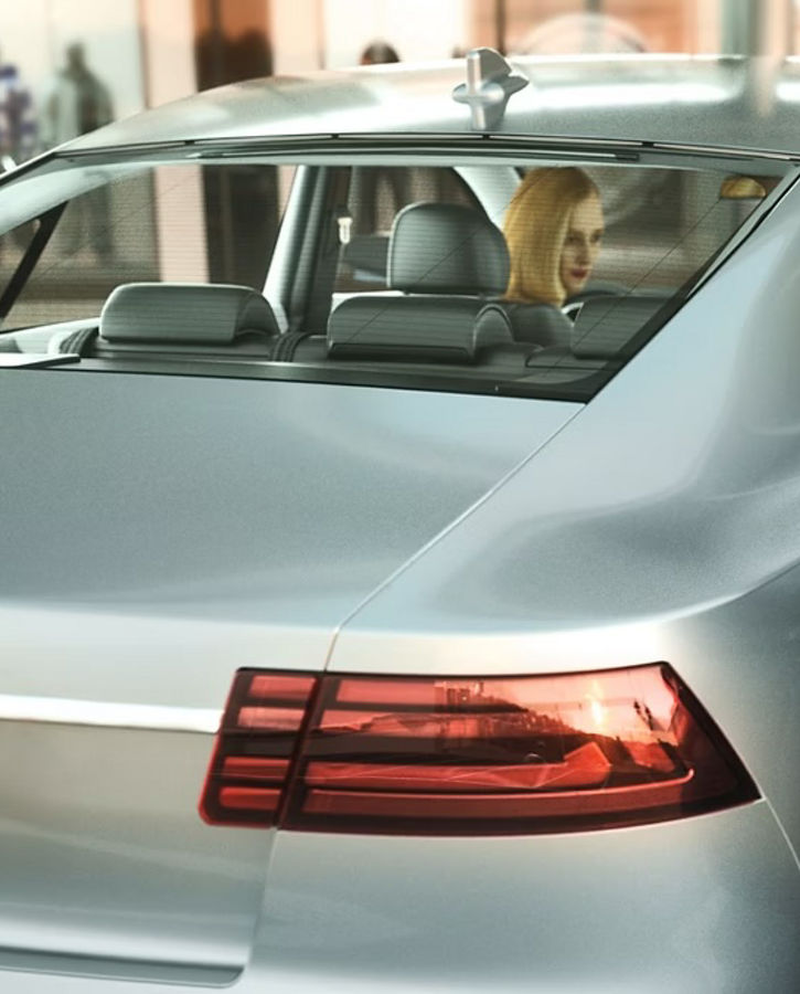 Image of a boy getting out of the rear door of a vehicle. The smart autonomous door stops automatically before it touches a vehicle parked next to it. Smart Autonomous Doors provide a convenient, safe as well as fully autonomous door opening and closing via a smart device and pave the way for future automated driving.