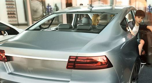Image of a boy getting out of the rear door of a vehicle. The smart autonomous door stops automatically before it touches a vehicle parked next to it. Smart Autonomous Doors provide a convenient, safe as well as fully autonomous door opening and closing via a smart device and pave the way for future automated driving.