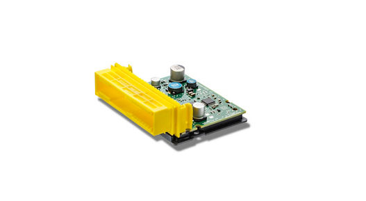 Compact airbag control unit featuring a green printed circuit board with essential electronic components such as capacitors and ICs. A bright yellow connector housing is attached for electrical connection. The design emphasizes a smaller footprint for space-constrained automotive applications.