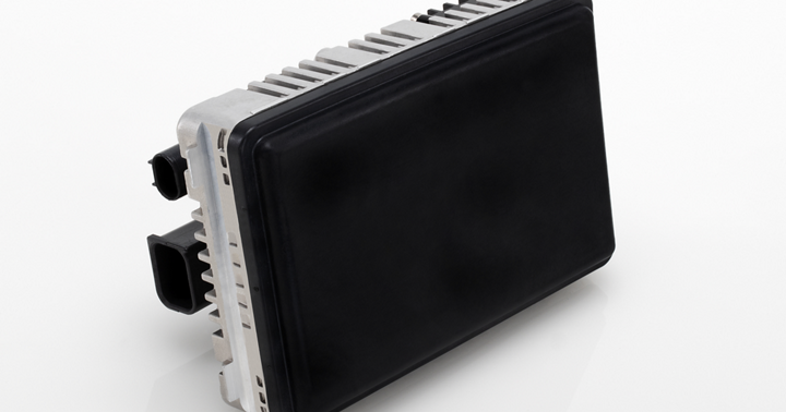 Black radar sensor with dual connectors and robust casing for vehicle safety systems.