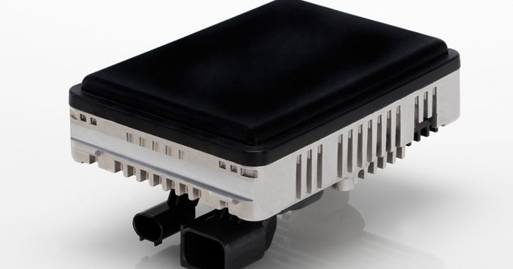 High-performance radar sensor featuring black top cover, silver heat sink, and dual connectors for ADAS systems.