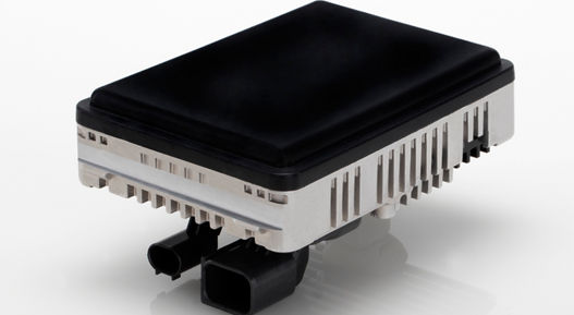 High-performance radar sensor featuring black top cover, silver heat sink, and dual connectors for ADAS systems.