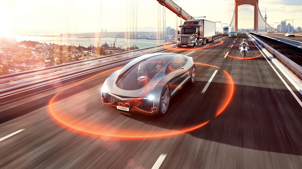 A futuristic vehicle drives on a bridge with other road users such as a motorcycle and a truck. Around the vehicles, you can see orange sensor lines for assisted and automated driving.