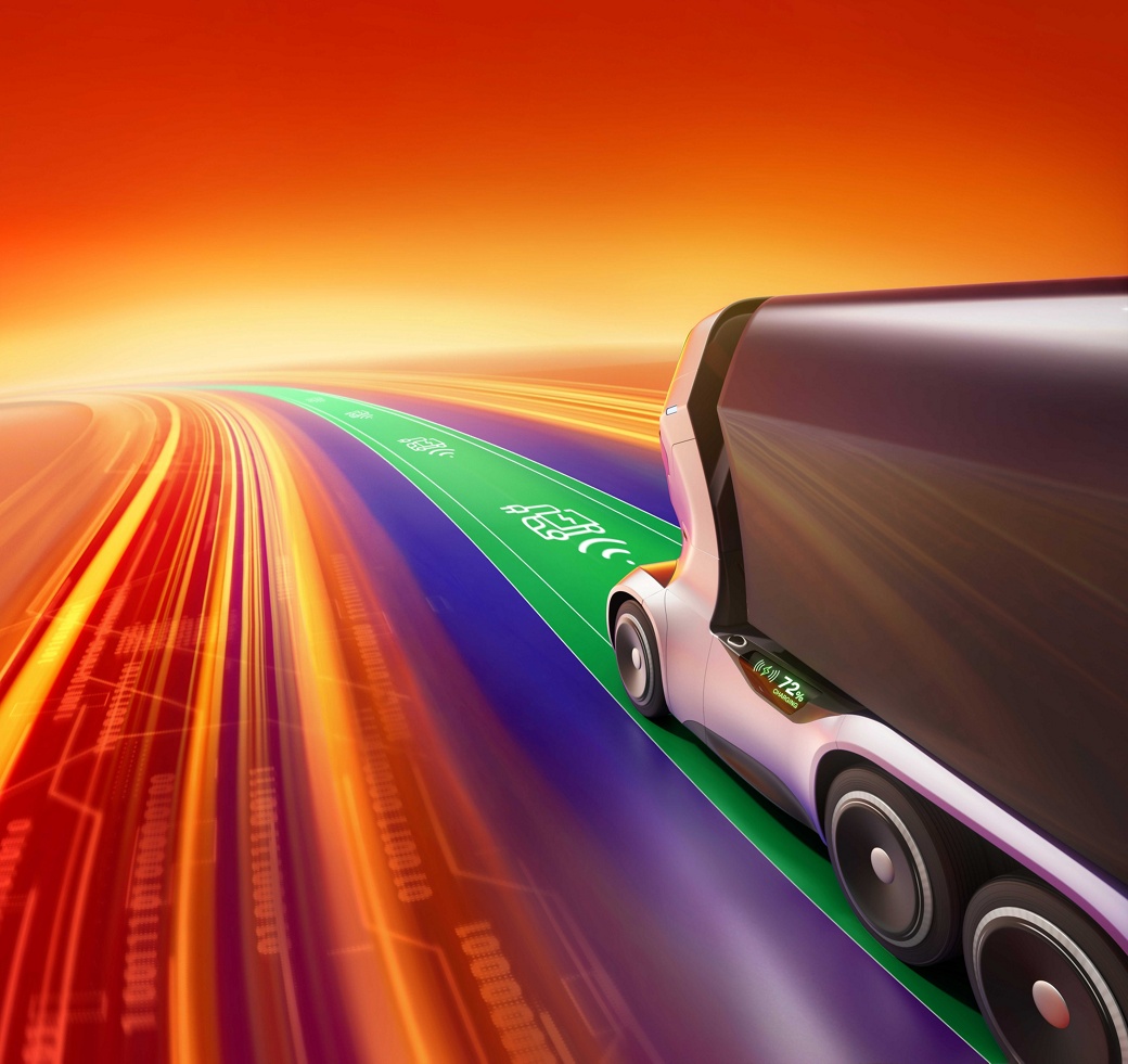 Futuristic autonomous concept truck on a green charging line speeding along a digital highway, surrounded by dynamic motion blur in orange, yellow, and purple light streaks against a vivid red-orange background. Electrification: from vehicle to fleet ecosystem