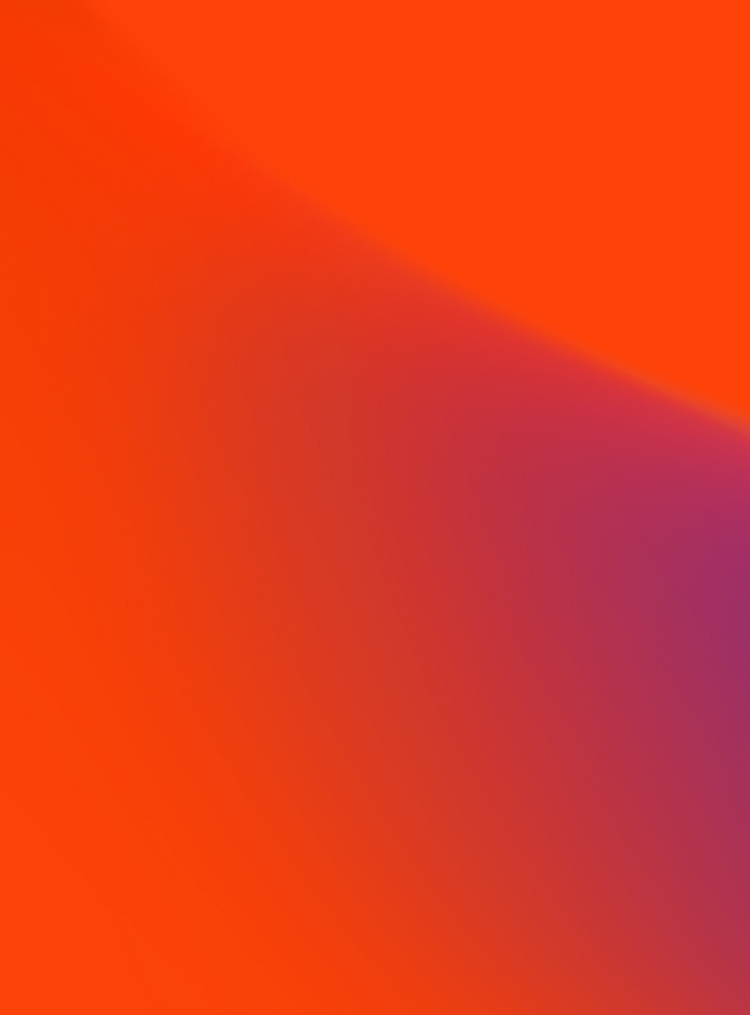 A vibrant abstract background featuring a smooth gradient blend of orange, red, and purple tones, creating a dynamic and modern visual effect.