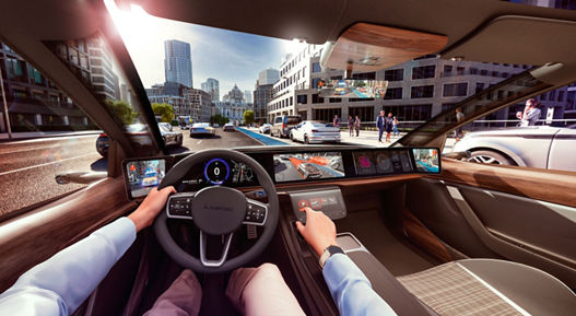 View through the windshield from inside the vehicle, from the driver's perspective over the dashboard to a traffic situation outside the vehicle. The external environment is displayed on several screens in the vehicle, including messages and warnings. AUMOVIO's state-of-the-art expertise in visualizing the vehicle and its surroundings is the result of many years of experience in the field of human vision.  Translated with DeepL.com (free version)