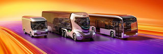 Three futuristic autonomous commercial vehicles driving along a digital highway on AUMOVIO background.