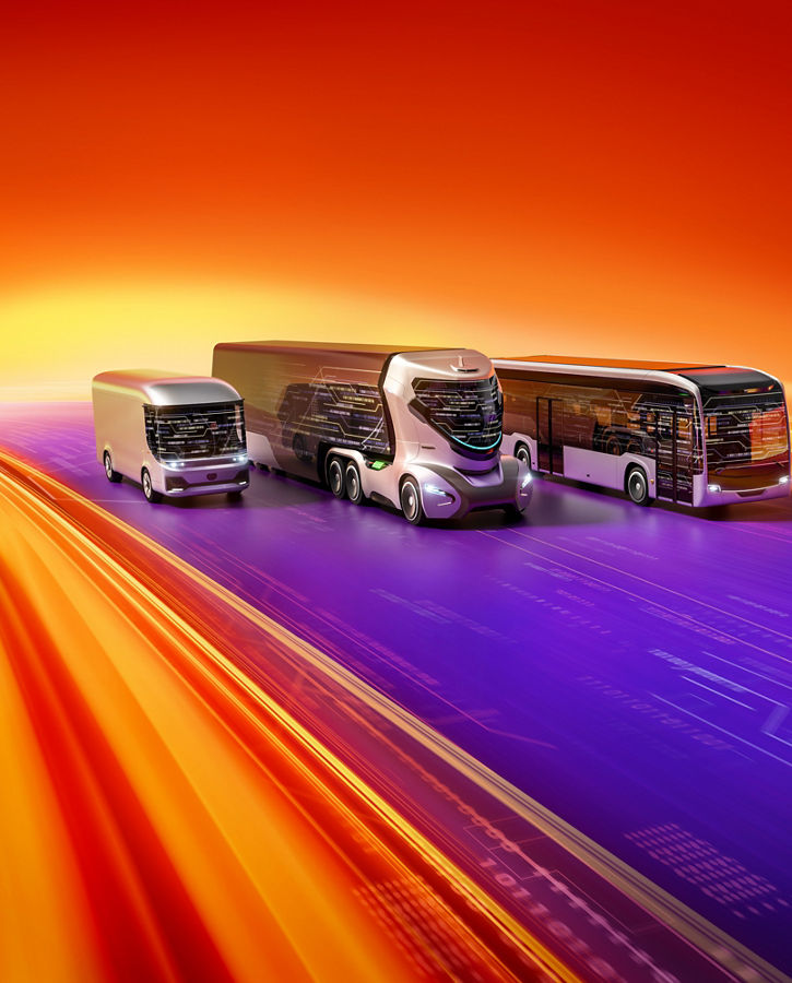 Three futuristic autonomous commercial vehicles driving along a digital highway on AUMOVIO background.