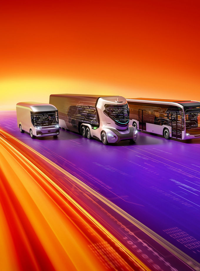 Futuristic autonomous concept truck, bus and van speeding along a digital highway, surrounded by dynamic motion blur in orange, yellow, and purple light streaks against a vivid red-orange background.
