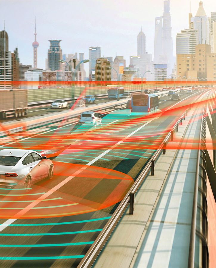Image of a vehicle on a highway. Orange and blue radar waves scan the area around the vehicle and detect other road users. Assisted driving systems support drivers with tasks such as lane keeping, braking, and parking, while automated driving takes it a step further.