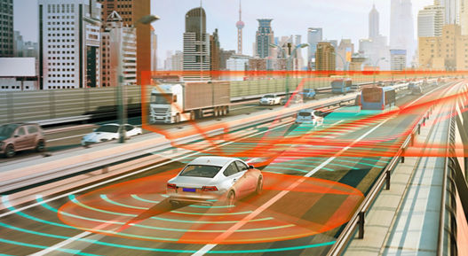 Image of a vehicle on a highway. Orange and blue radar waves scan the area around the vehicle and detect other road users. Assisted driving systems support drivers with tasks such as lane keeping, braking, and parking, while automated driving takes it a step further.