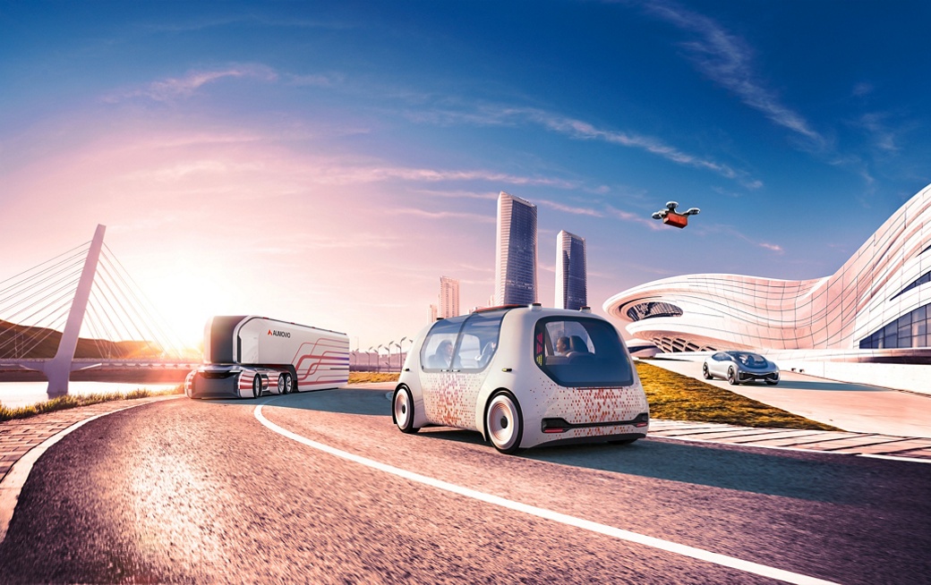 The image shows a traffic scene on a highway with futuristic buildings in the background, a futuristic truck and car, and a drone in the air. The Autonomous Mobility business area offers a comprehensive range of products for automated and autonomous driving.