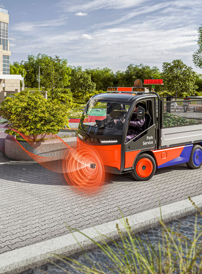 The image shows an Acoustic Vehicle Alerting System (AVAS) in a cleaning vehicle used by a parking service. AVAS offers reliable and user-friendly solutions designed for installation in various types of vehicles.