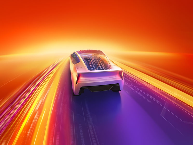 A sleek, futuristic car driving on a vibrant, glowing digital highway with dynamic orange, yellow, and purple light trails, symbolizing innovation and the future of mobility.