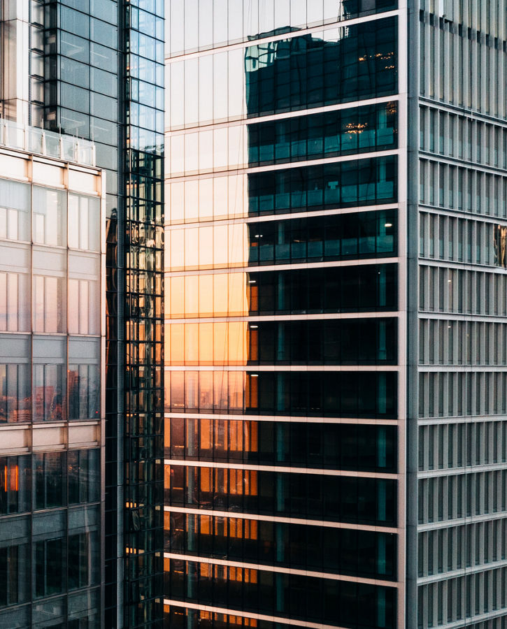 close-up of tall office buildings at sunset