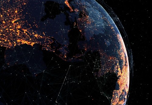 A nighttime view of Earth taken from space; brightly lit infrastructure can be seen on the continents.  With AUMOVIO's development vehicles we are on the road in many countries. Based on our recordings, places all over the world can be explored.