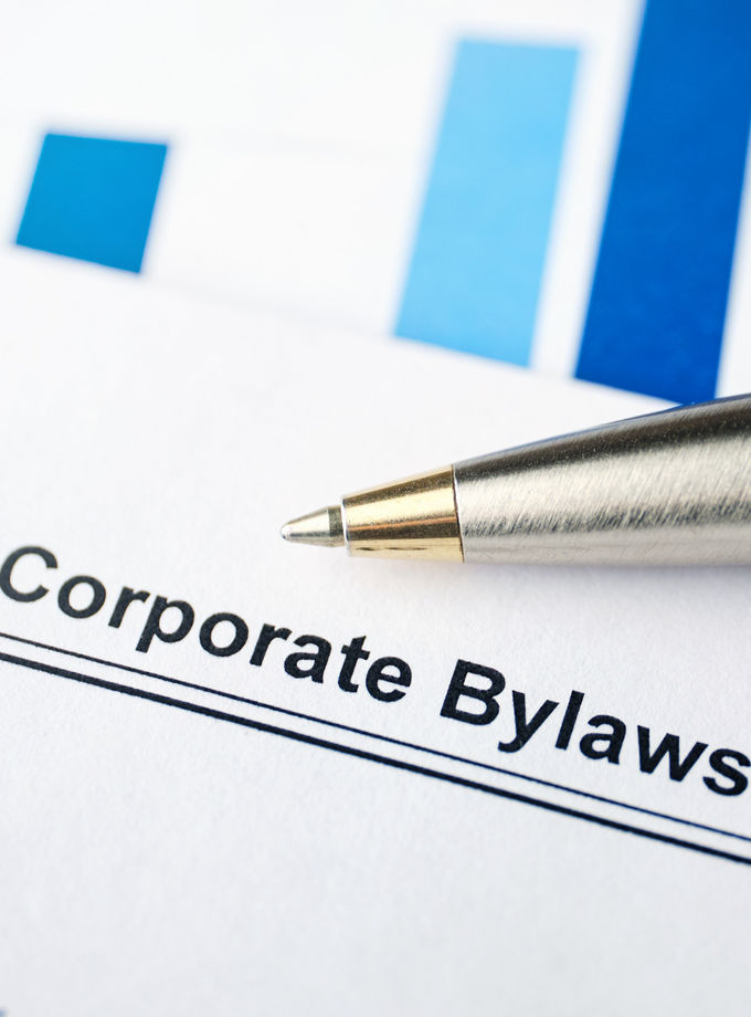 Legal document Corporate Bylaws on paper with pen