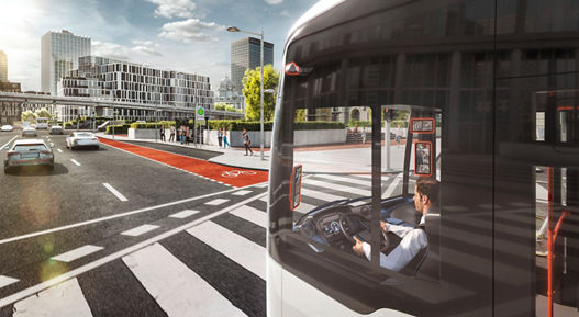 City bus equipped with digital mirror system for improved visibility in urban traffic environment.