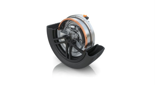 Detailed cross-sectional view of a tire with an integrated drive brake unit. The internal structure includes metallic components and a copper-colored ring, emphasizing the innovative design for space-saving and efficient braking.