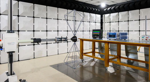Image of an EMC testing laboratory. EMC testing services ensure that electronic systems operate reliably in environments with electromagnetic interference, while meeting global regulatory and OEM-specific standards. Our accredited laboratories offer comprehensive testing capabilities, including emissions, immunity, transient, and ESD evaluations, using advanced chamber technologies and near-field scanning.