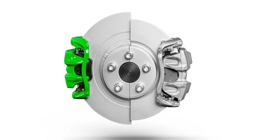 Automotive brake disc with two calipers mounted on opposite sides, one in bright green and the other in silver, illustrating a dual-caliper braking system.