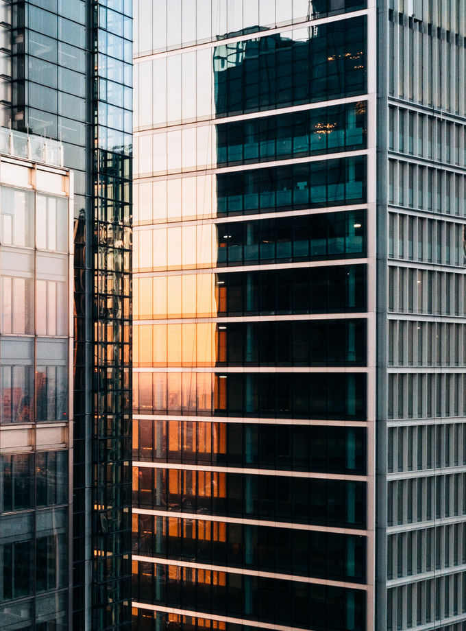 close-up of tall office buildings at sunset