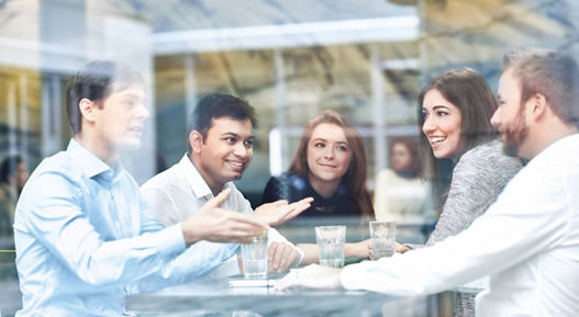 Team discussion in a meeting room.