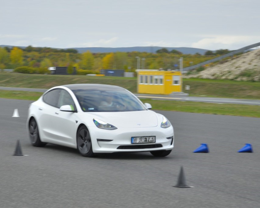 white car driving on road, vehicle testing