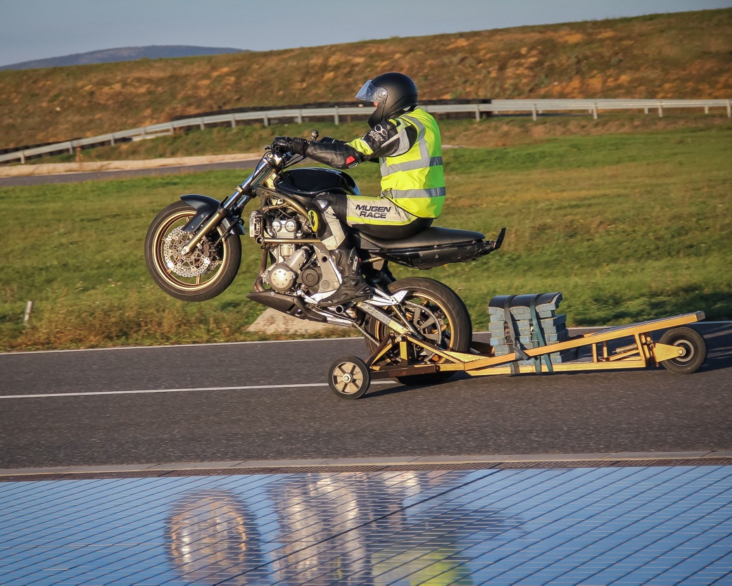motorcycle on road with system technologies in demo test driving