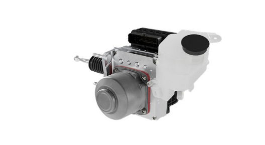 Close-up view of the MK C2 brake system module. The unit includes a metallic cylindrical actuator, a black electronic connector block, and a translucent white brake fluid reservoir with a black cap. The design highlights the integration of hydraulic and electronic components for advanced braking systems.