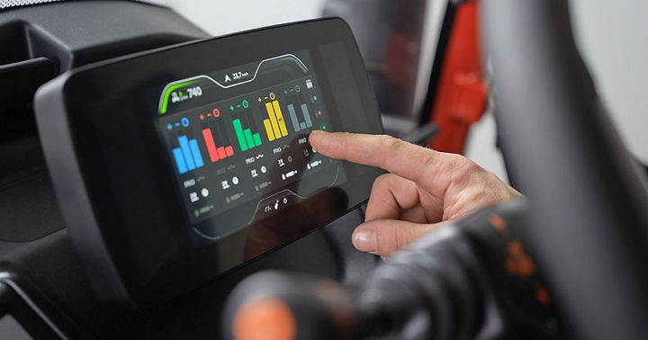 Close-up picture of the MultiViu® Compact 7. The driver taps his finger on the of our MultiViu® Compact 7 display to make adjustments.