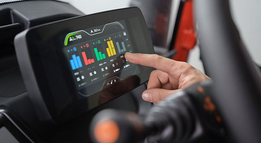 Close-up picture of the MultiViu® Compact 7. The driver taps his finger on the of our MultiViu® Compact 7 display to make adjustments.