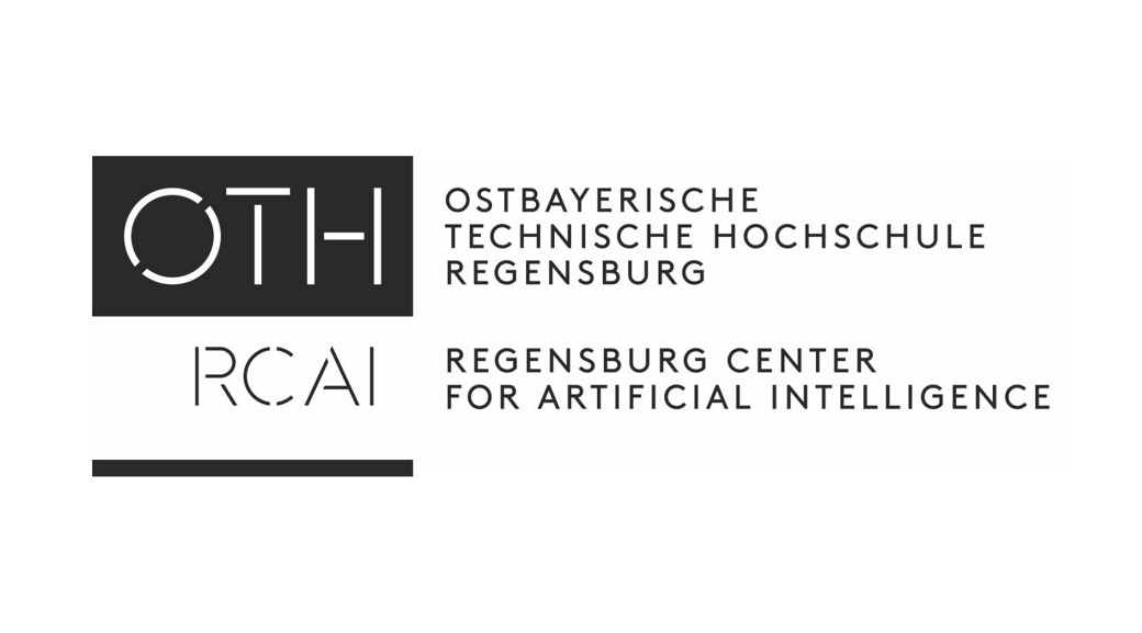 Logo of OTH-RCAI. The Regensburg Center for Artificial Intelligence (RCAI) is the research center for artificial intelligence at the Ostbayerische Technische Hochschule (OTH) in Regensburg, Germany. It connects AI activities and expertise from all faculties to share knowledge and promote progress in the most diverse aspects of artificial intelligence.