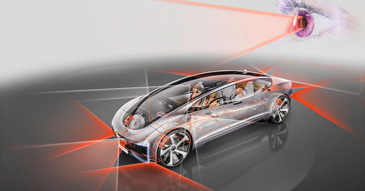 Image of AUMOVIO's semi-transparent concept vehicle with various sensors and orange and white lines that visualize the scanning of the surroundings. AUMOVIO's pre-crash monitor includes radar and camera-based safety functions, ADAS for trucks, functional safety development, testing and validation on test tracks, and endurance testing.
