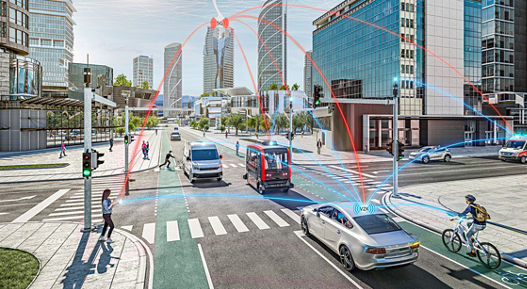 Image of a traffic scene at an intersection in the city, where several road users such as cars, cyclists, pedestrians, buses, and emergency vehicles communicate with each other via a cloud. The connection between the road users and the cloud is represented by orange and blue lines. Safety and Security is designed to ensure safe and secure vehicle operation, AUMOVIO's safety and security solution informs and protects drivers in potentially unsafe situations.