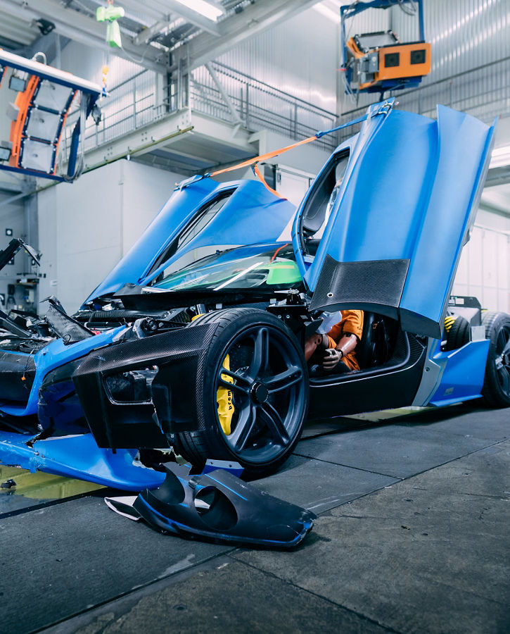 Image of a destroyed crash test vehicle after impact in a crash test facility