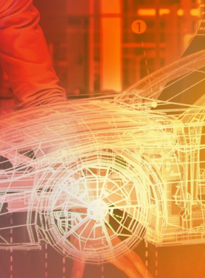Digital wireframe model of a car displayed in a glowing red-orange overlay, symbolizing software-defined vehicle technology. The background shows engineers and technical equipment, emphasizing innovation in automotive software and virtual development environments.