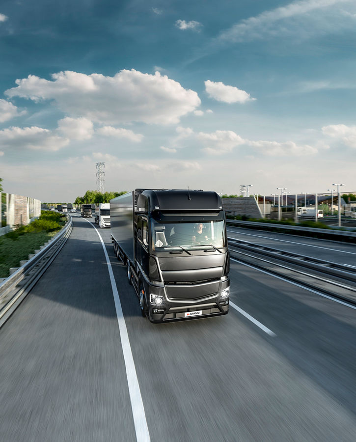 The image shows a truck on a highway as an example of the AUMOVIO tolling solutions. Empowering tolling providers with all the necessary information and management tools to create, deploy and run successful road user charging schemes.