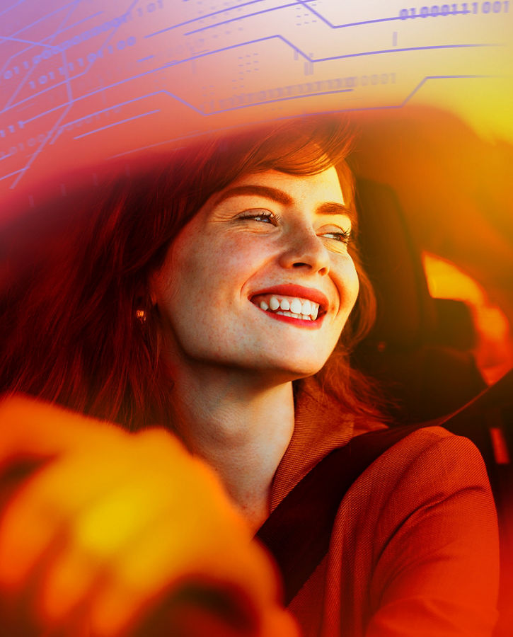 Beautiful young woman driving her new car at sunset. Woman in car. Close up portrait of pleasant looking female with glad positive expression, woman in casual wear driving a car