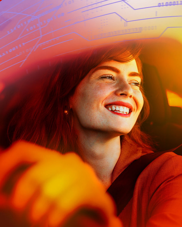 Beautiful young woman driving her new car at sunset. Woman in car. Close up portrait of pleasant looking female with glad positive expression, woman in casual wear driving a car