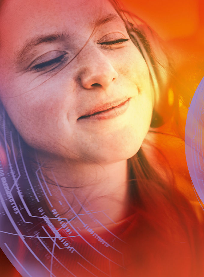 A woman enjoys her favorite music against the backdrop of city lights.