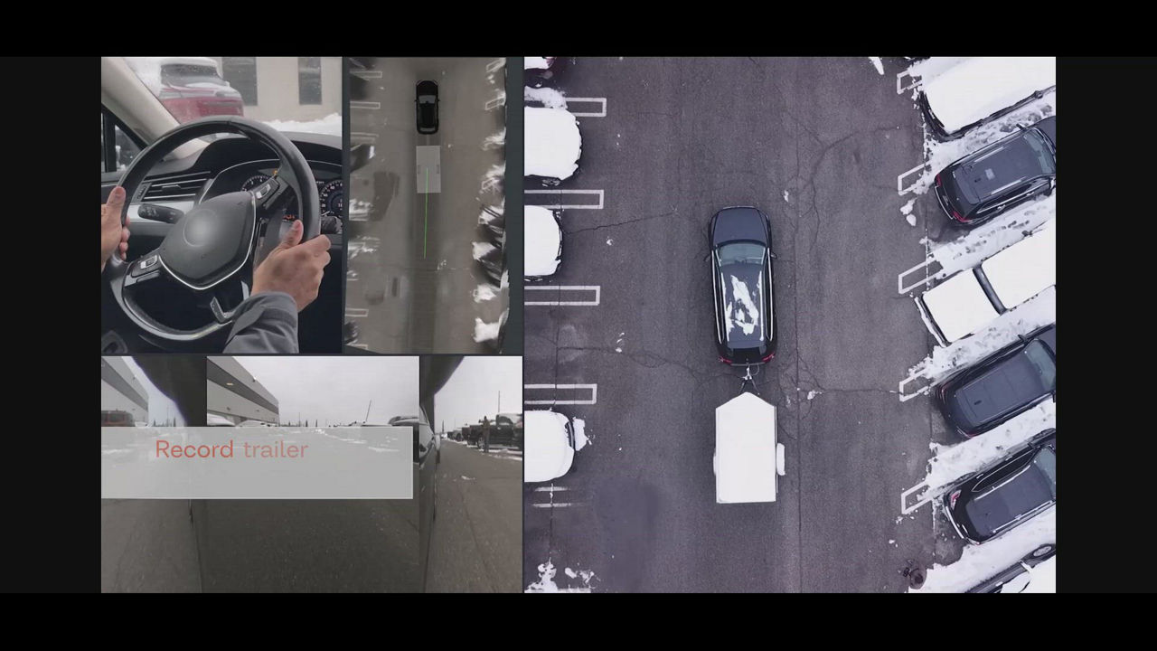 Video about AUMOVIO's trailer backtrack with remote control option, smart reversing from outside the vehicle. Allows drivers to maneuver their trailer in reverse using a mobile device or key fob—without being inside the vehicle.