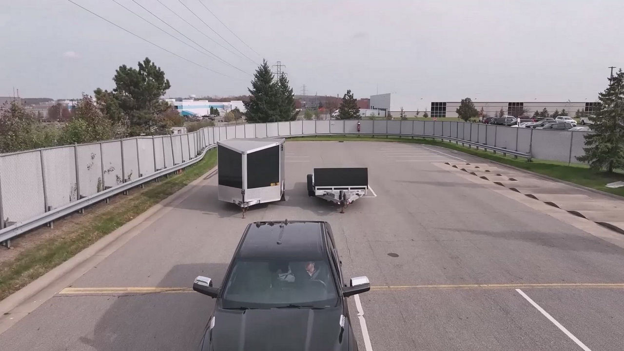 Video about AUMOVIO's trailer hitch assist, simplifying the connection process. Helps drivers align their vehicle and trailer with precision and ease by using existing back up camera in the vehicle. 