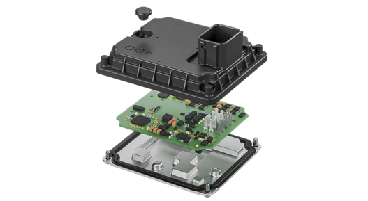 View of an automotive twin motor control unit showing three layers: black top housing with connector, green circuit board with electronic components, and silver bottom casing. Represents advanced power electronics and motor control technology for electric vehicles.