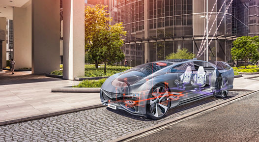 Futuristic car parked on a city street in front of modern glass buildings, with transparent overlays showing electronic components and wiring inside the vehicle, representing advanced electrical and electronic architecture.